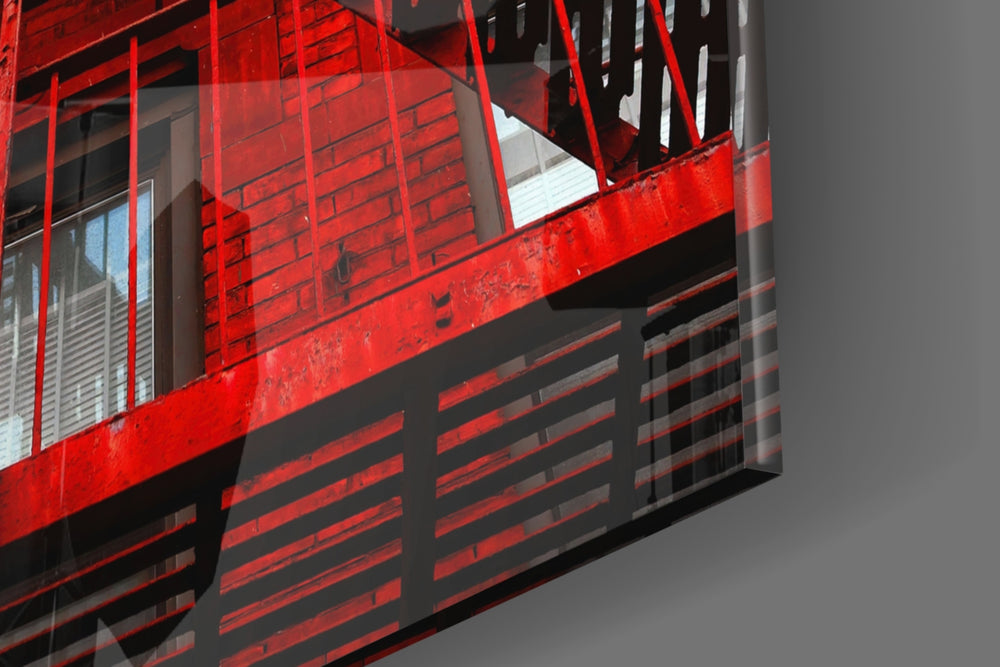 Red Stairs panel catching window light to reveal its tactile rivet
