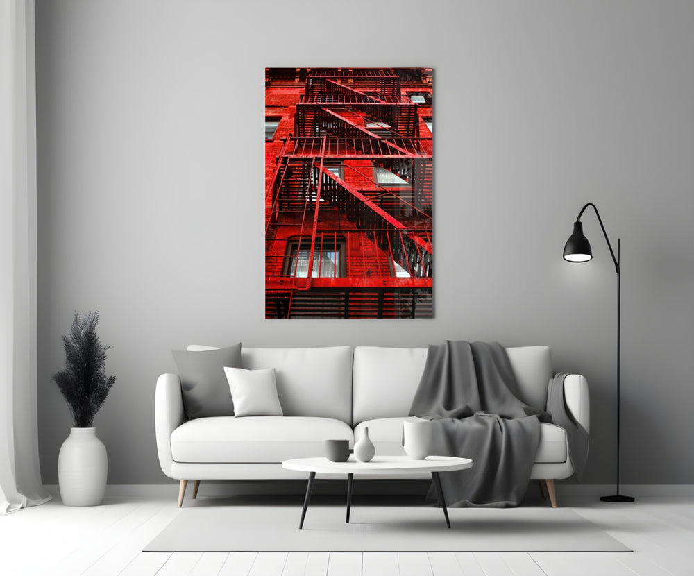 Red Stairs glass wall art styled above a sofa in a man's office