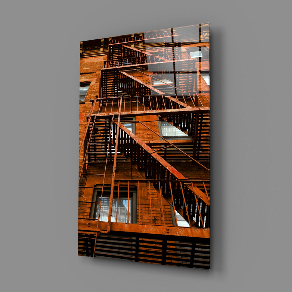Orange Stairs close-up showing orange iron railings against concrete facade
