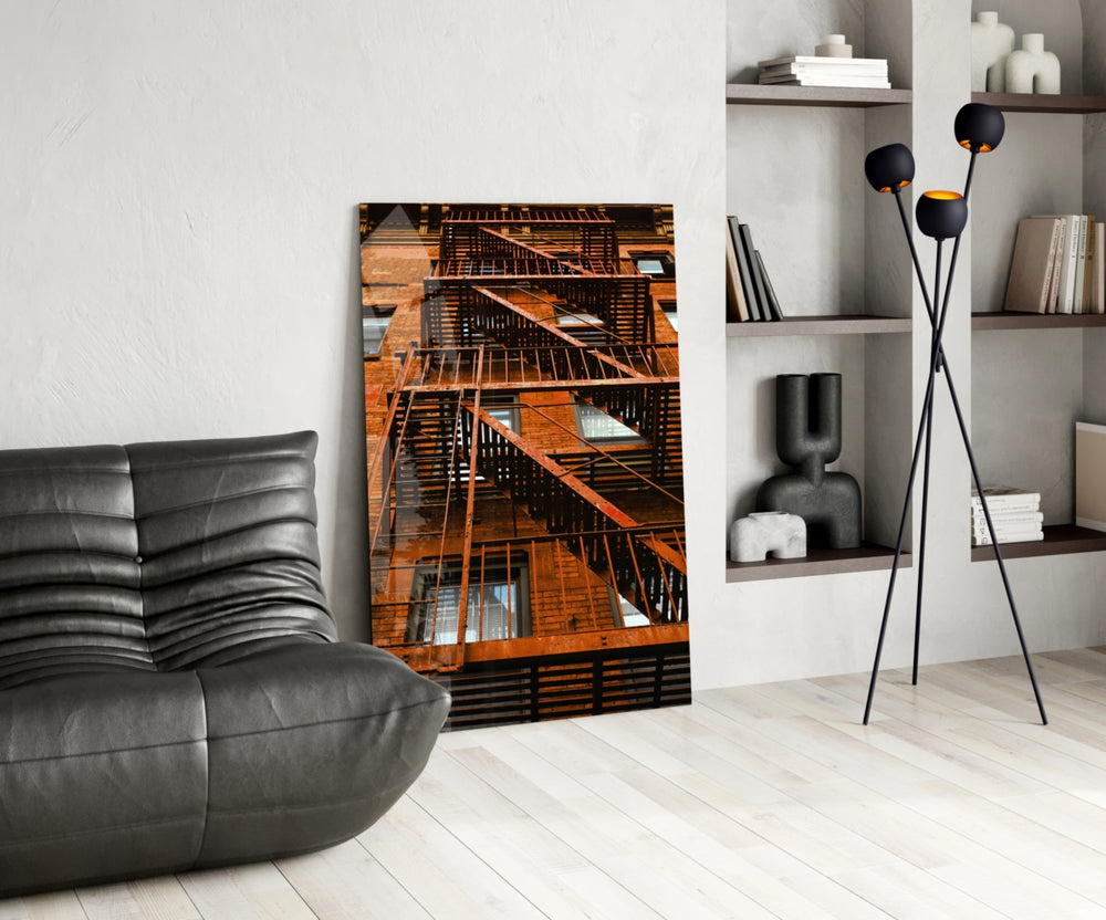 Orange Stairs glass print enhancing a man's office with cinematic drama