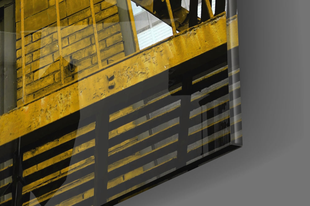 Yellow Stairs panel catching window light to reveal its tactile rivet
