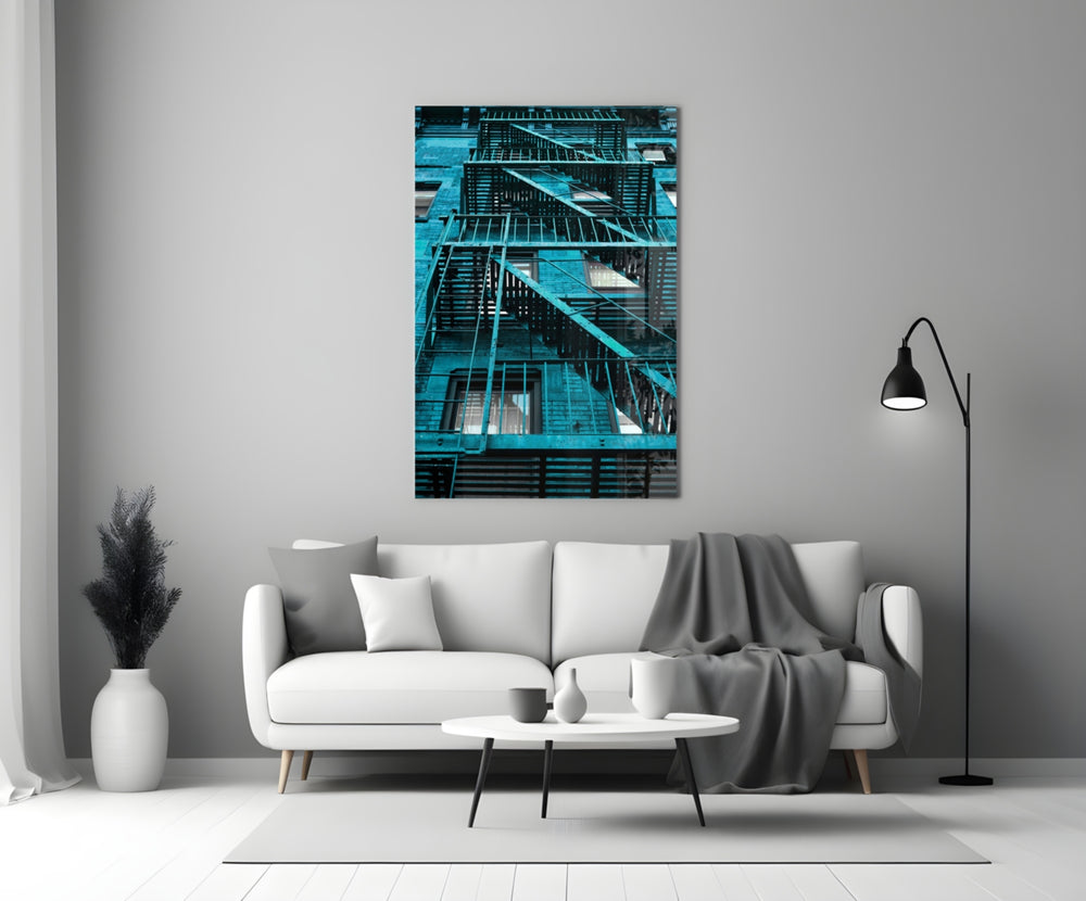 Blue Stairs glass wall art styled above a sofa in a man's office