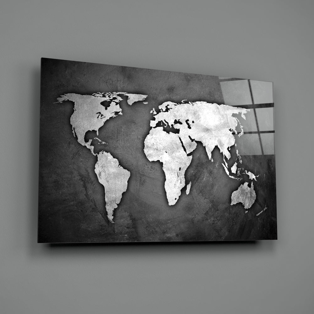 Grunge World Map close-up showing chalked continents on weathered black