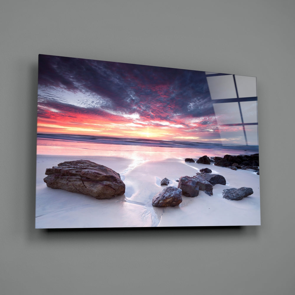 Beach Sunset close-up showing wet sand mirroring violet sunset clouds
