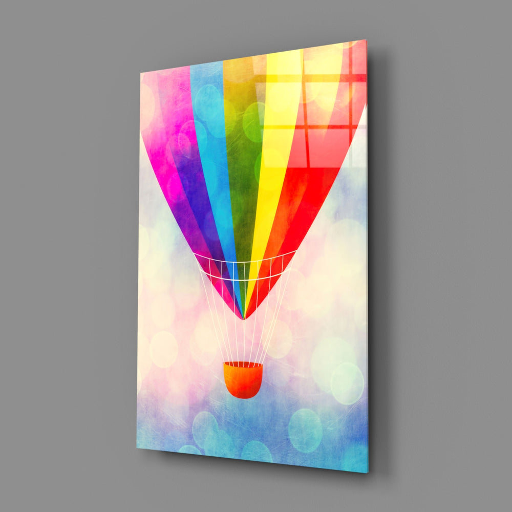 Rainbow Balloon close-up showing magenta and yellow stripes against pastel clouds