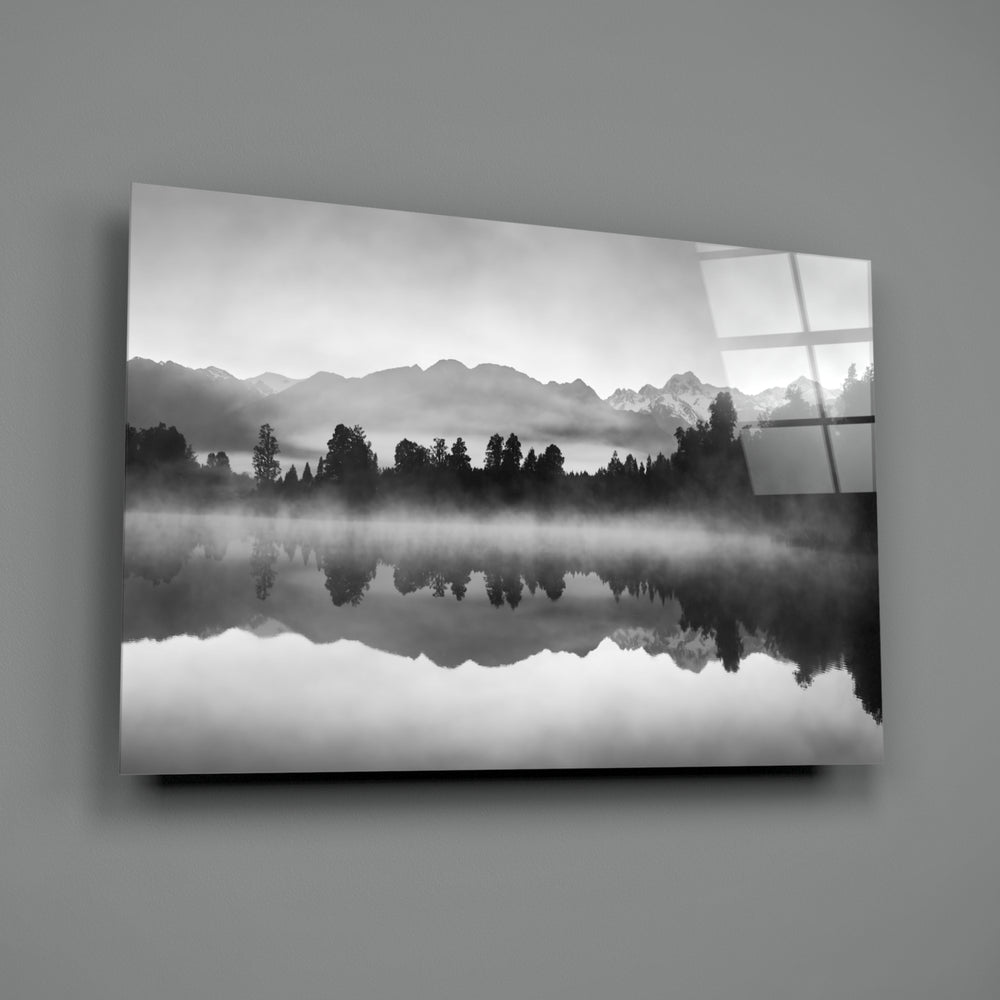 Misty Lake close-up showing forest silhouette mirrored across calm water