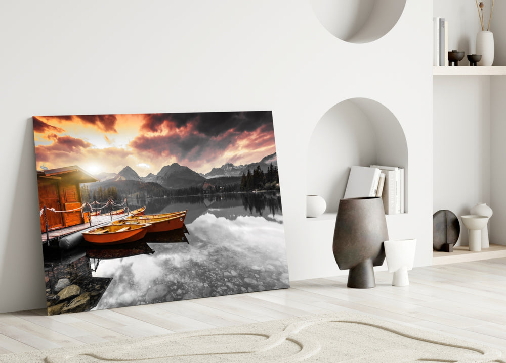 Sunrise Lake glass wall art styled above a fireplace in a living room