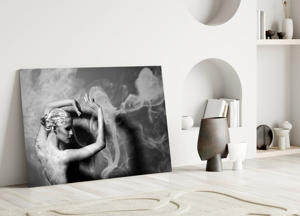 Smoke Dancer glass wall art styled above a coffee table in a master bedroom