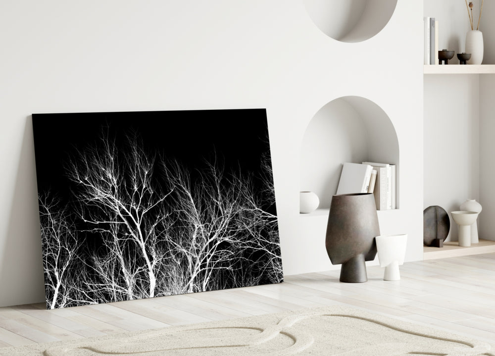 Night Trees glass wall art styled above a credenza in a master bedroom