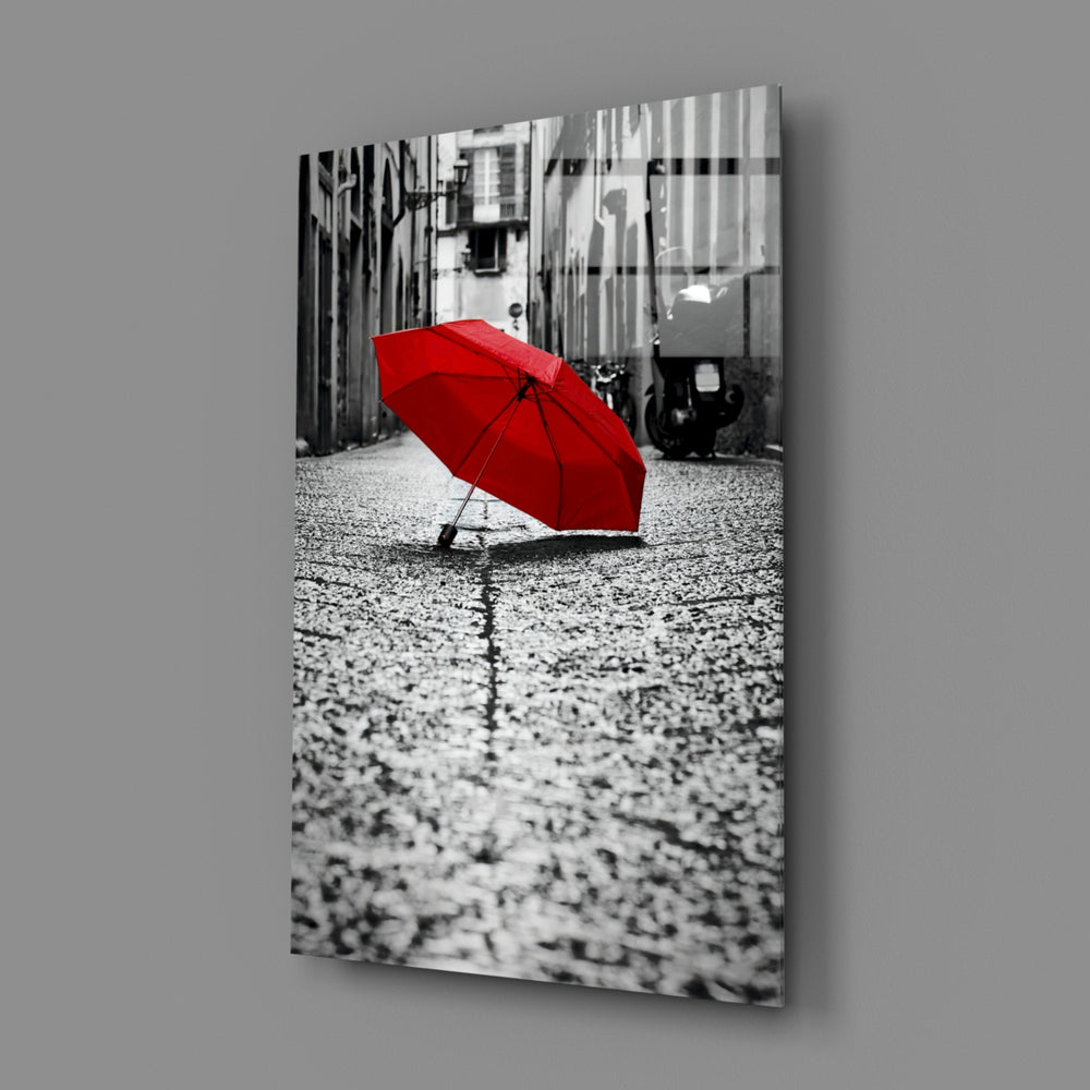Red Umbrella close-up showing red umbrella above silver-grey rainy street