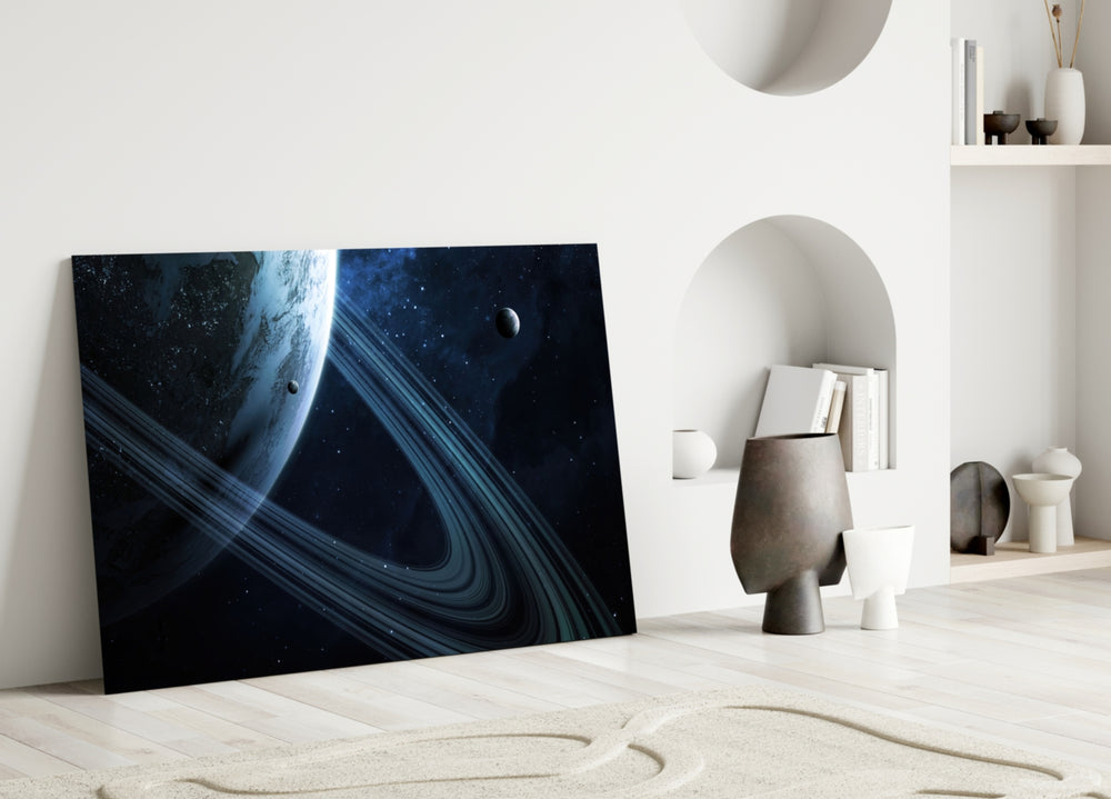 Ringed Saturn glass wall art styled above a sofa in a man's office