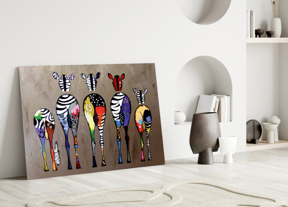 Colorful Zebras glass wall art styled above a modern sofa in a warm living room