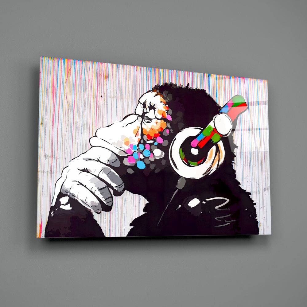 DJ Chimp close-up showing cyan-red-green headphones against monochrome chimp