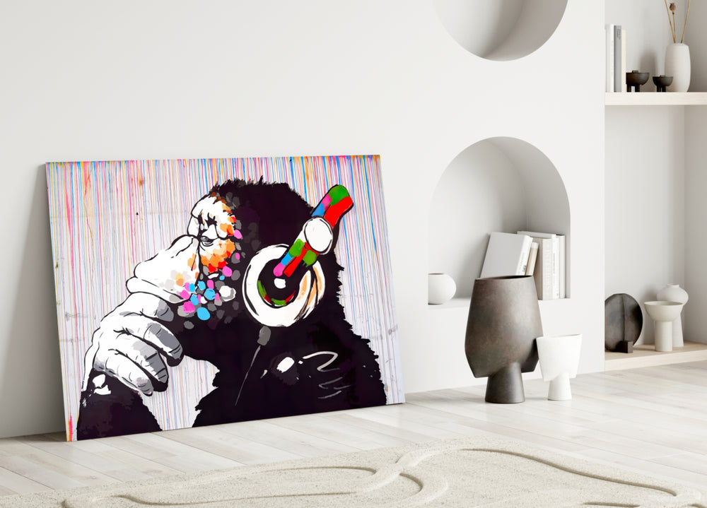 DJ Chimp glass wall art styled above a DJ booth in a music room