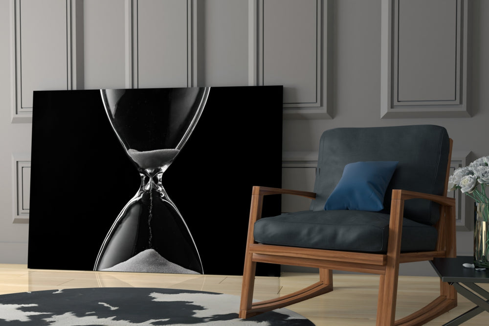 Hourglass Time artwork anchoring a wall with moody philosophical palette
