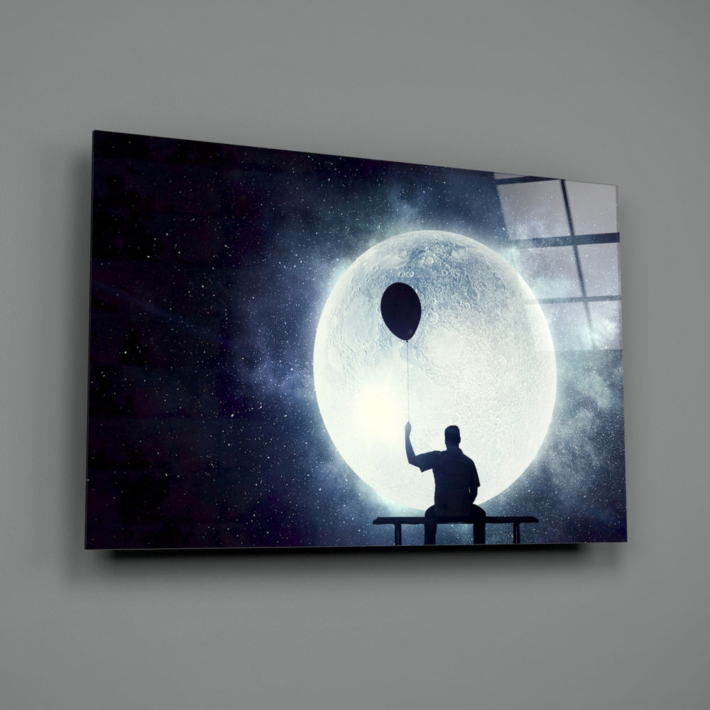 Moon Dreamer close-up showing silhouetted figure holding balloon under moon