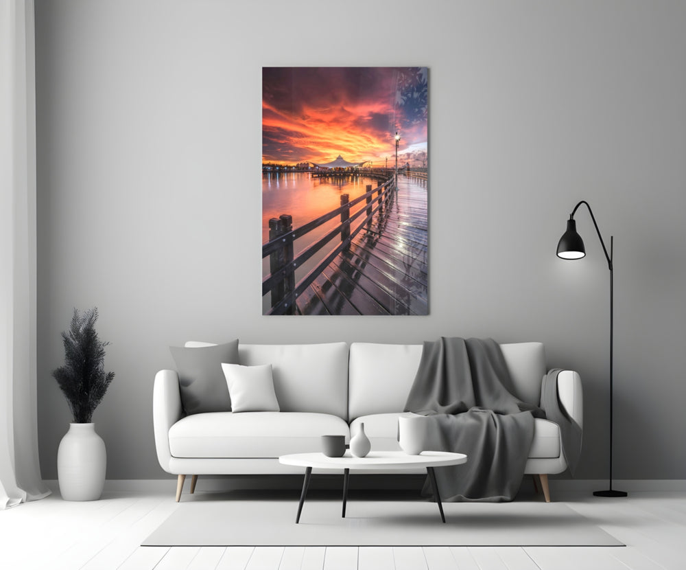 Pier Sunset glass wall art styled above a credenza in a master bedroom
