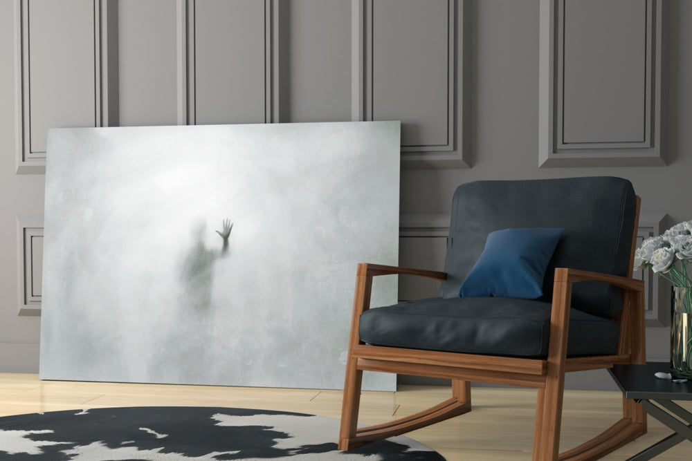 Despair artwork anchoring a wall with moody minimal palette