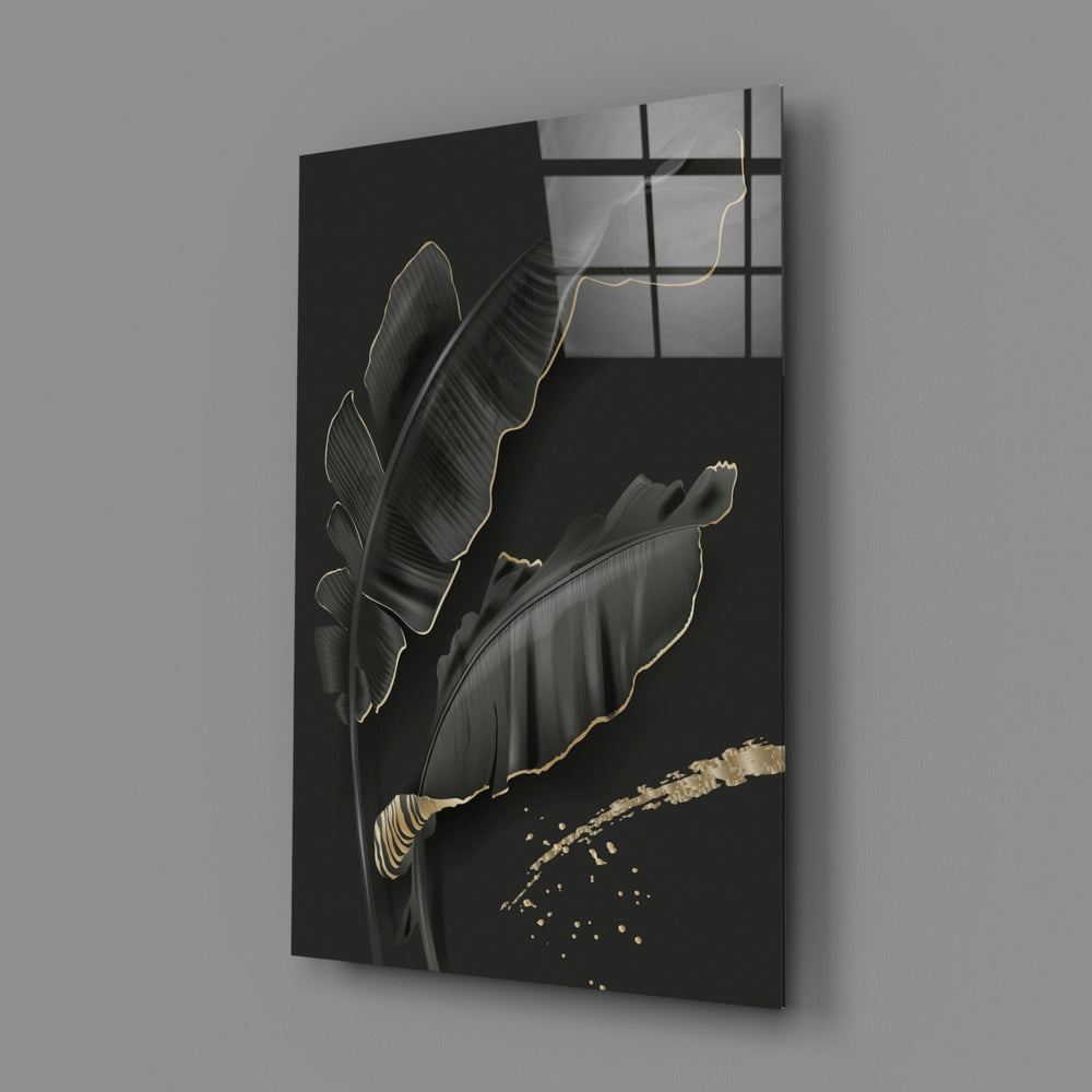 Leaf close-up showing dark banana leaves with gold-traced edges