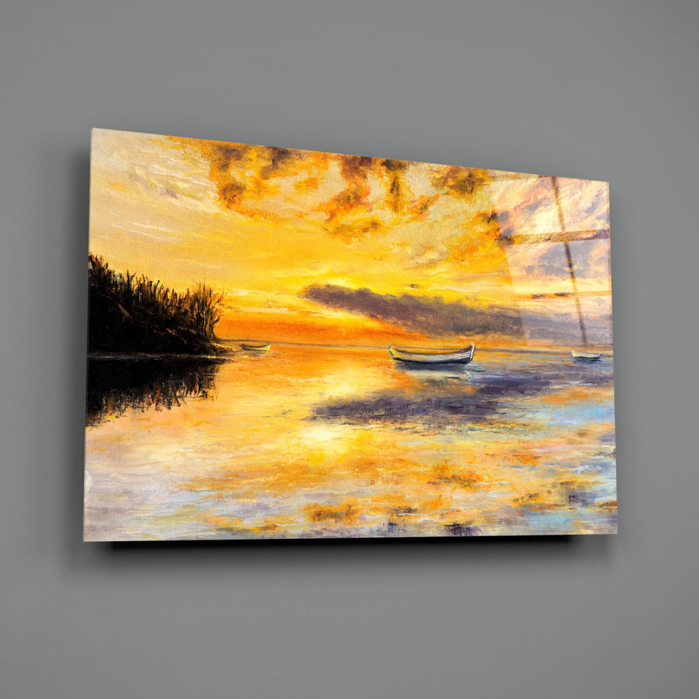 Landscape close-up showing small sailboats under amber sunset sky