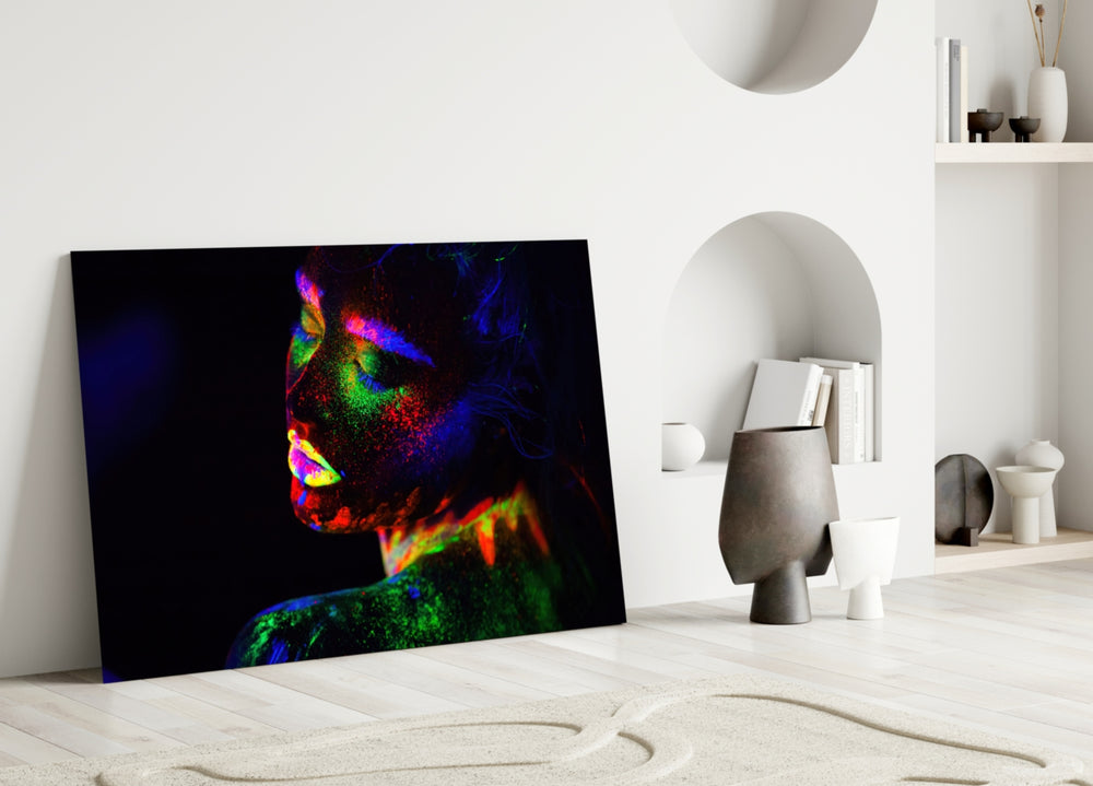 Neon Woman glass wall art styled above a credenza in a gaming room