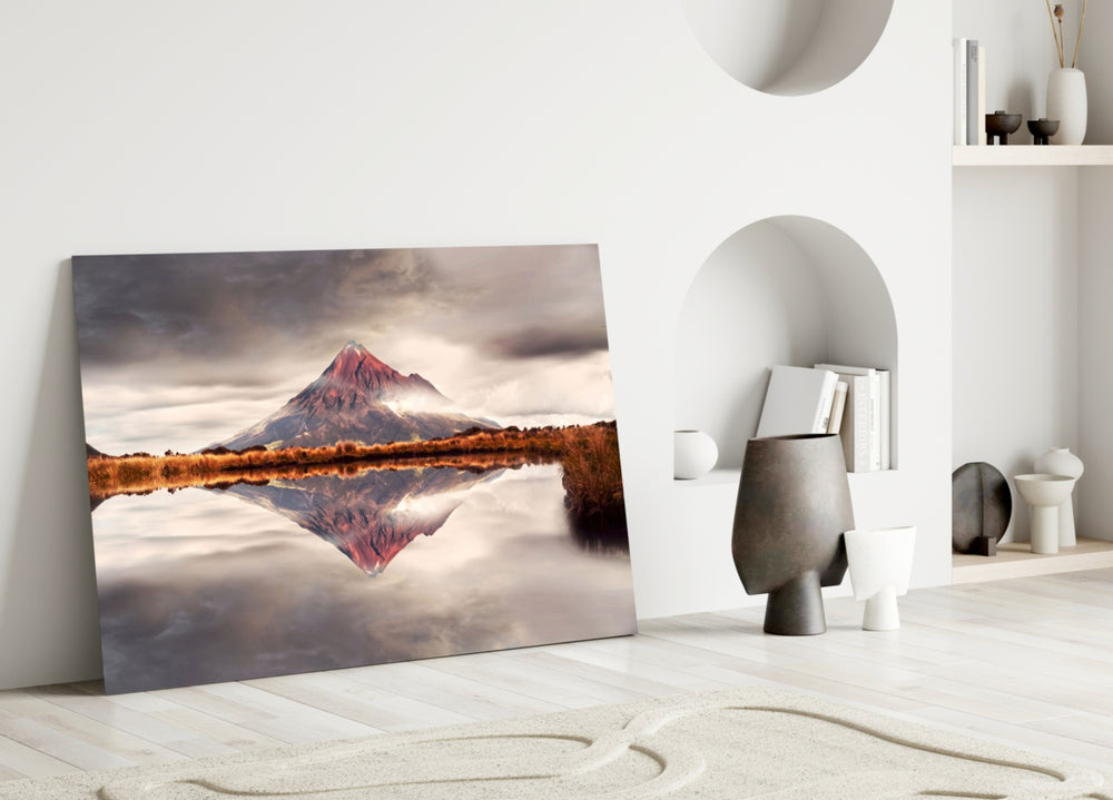 Mountain glass wall art styled above a credenza in a living room