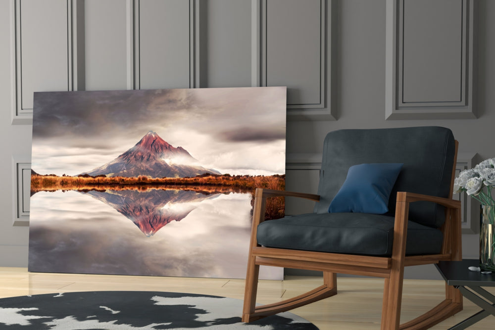 Mountain artwork anchoring a wall with serene nature palette