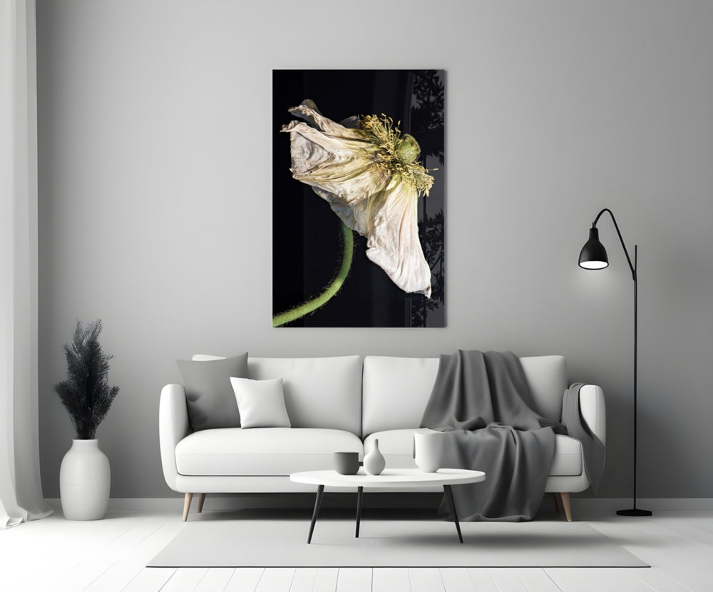 Flower glass wall art styled above a credenza in a living room