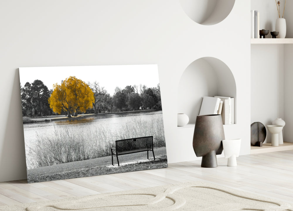 Yellow Tree glass wall art styled above a credenza in a living room