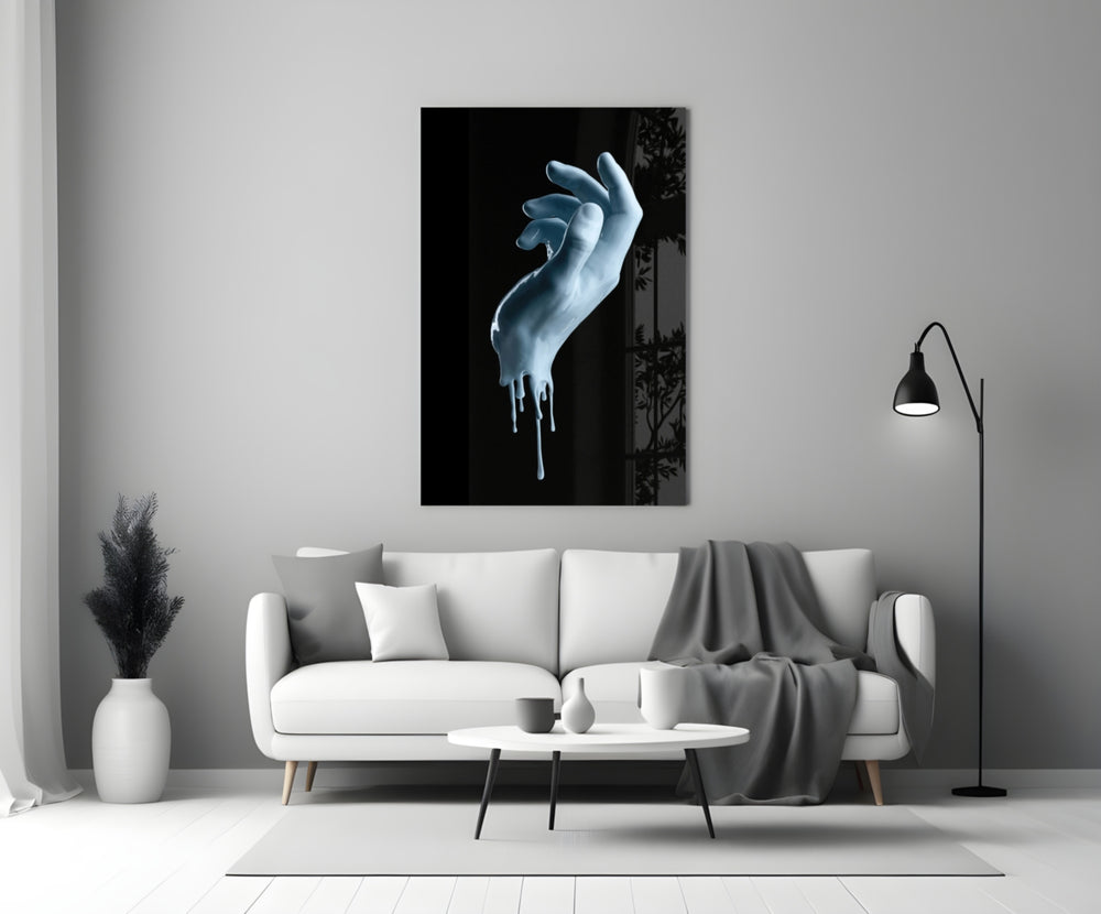 Hand glass wall art styled above a console in a gaming room