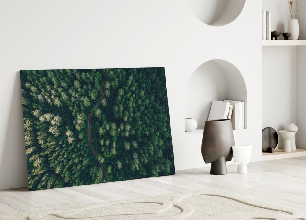 Forest glass wall art styled above a credenza in a living room