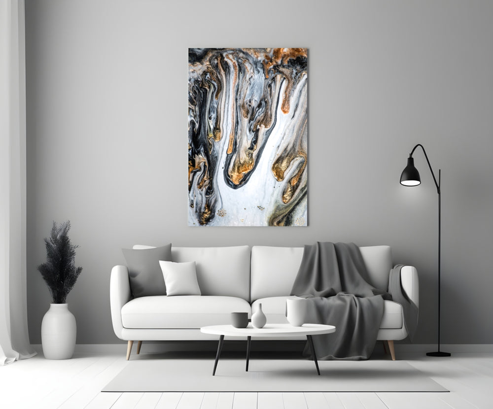Abstract glass wall art styled above a credenza in a living room