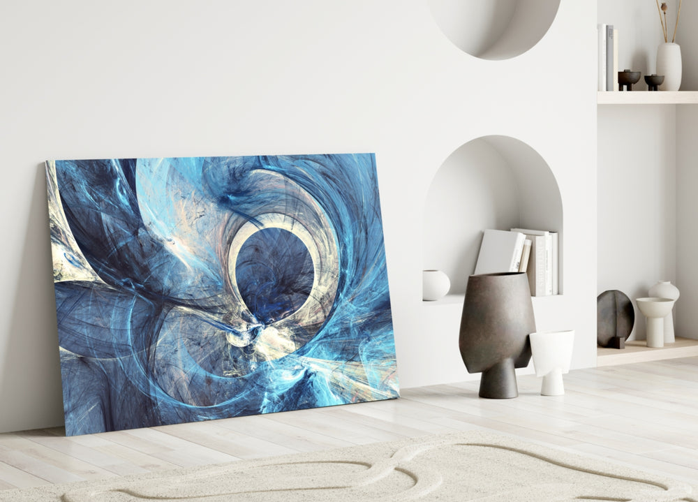 Abstract glass wall art styled above a credenza in a living room