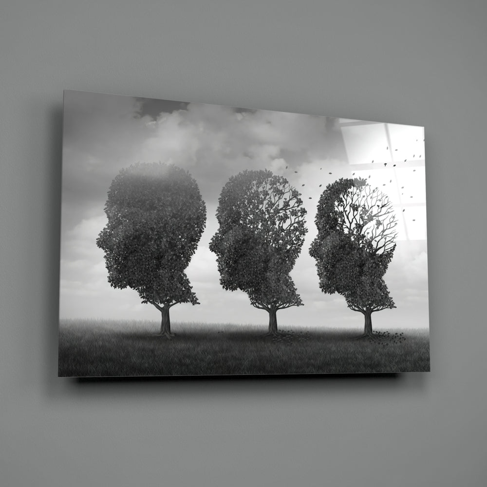 Autumn of Thoughts close-up showing three head-shaped trees with leaves blowing