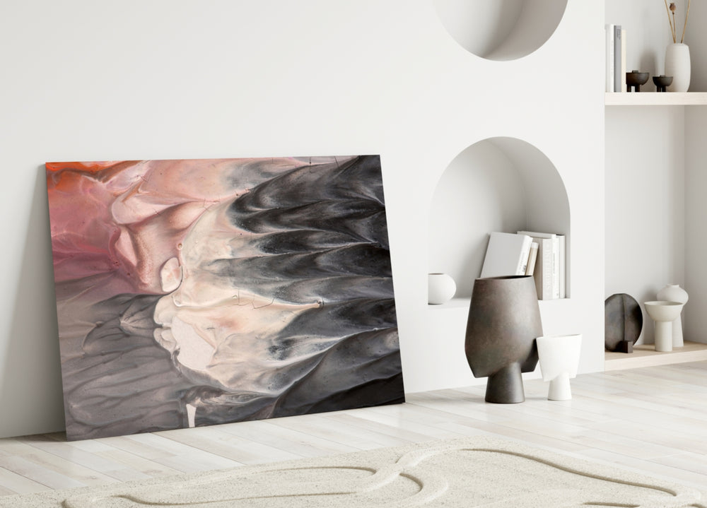Abstract glass wall art styled above a sofa in a living room