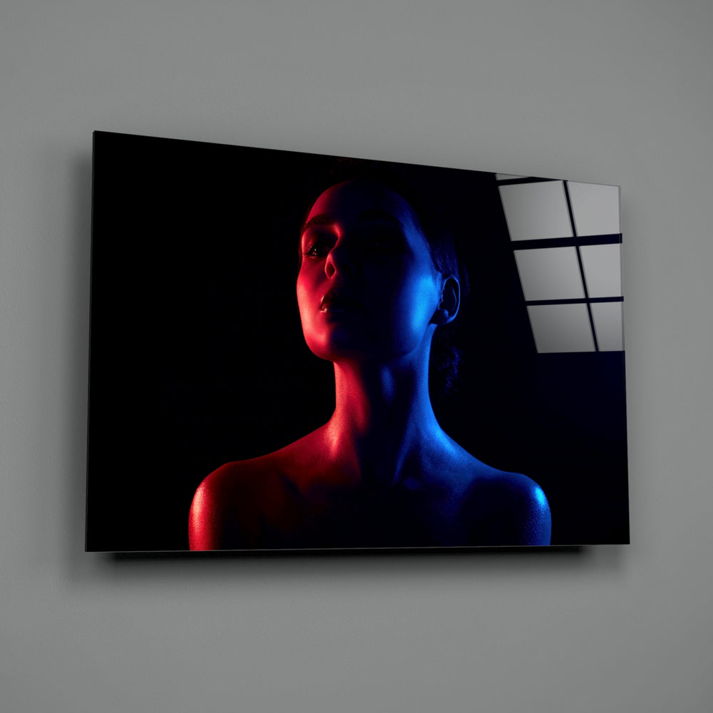 Women's close-up showing gel-lit woman with crimson and cobalt skin glow
