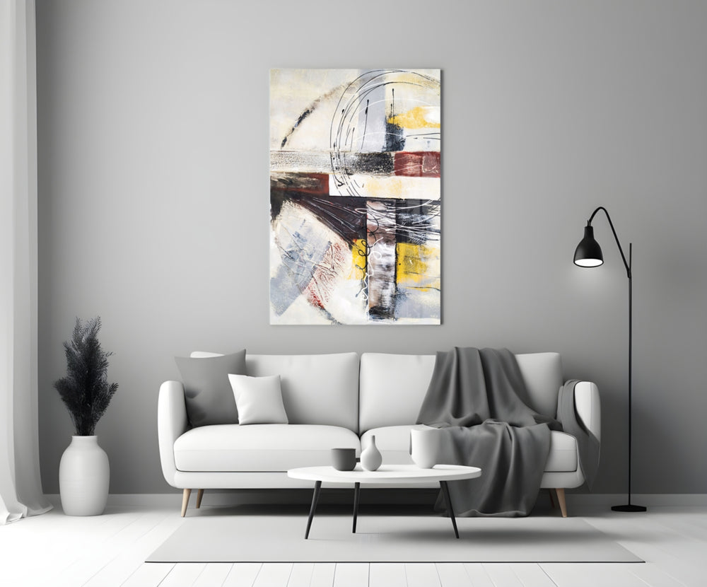 Abstract glass wall art styled above a sofa in a living room