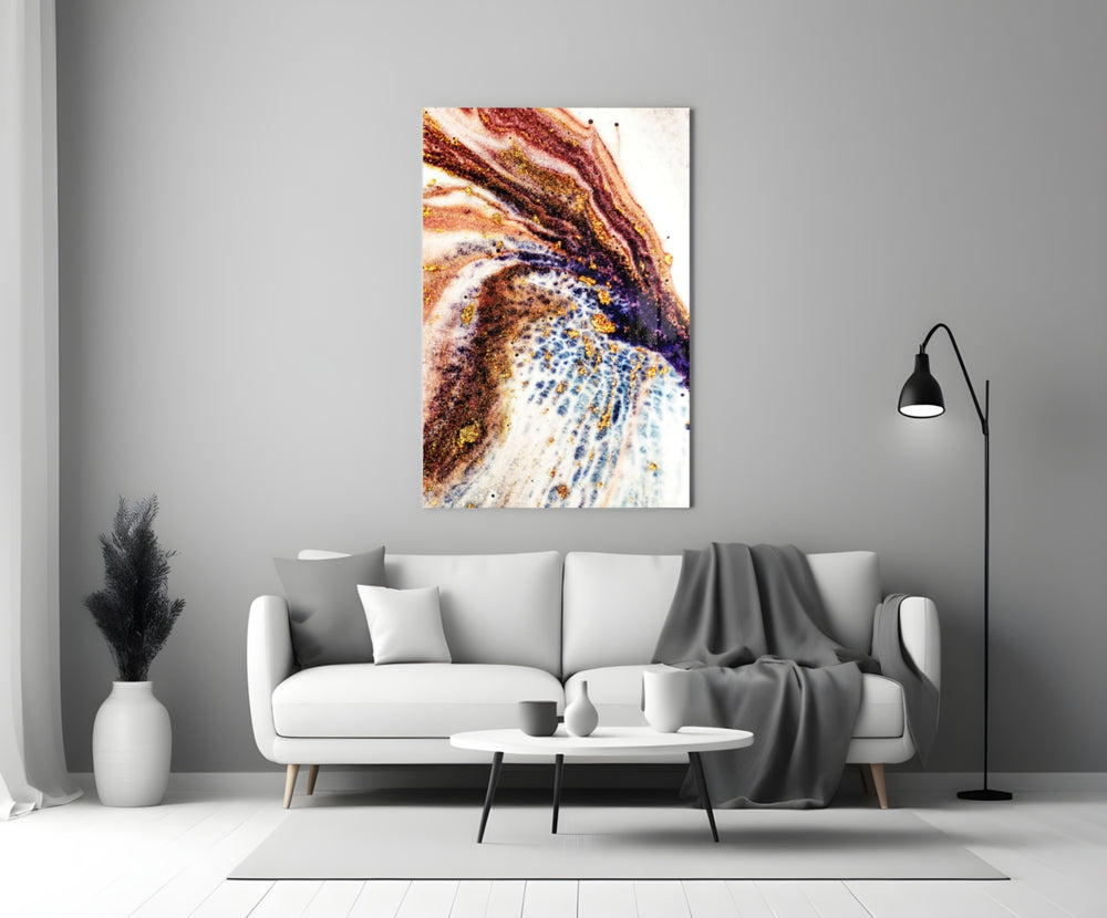 Abstract glass wall art styled above a credenza in a living room