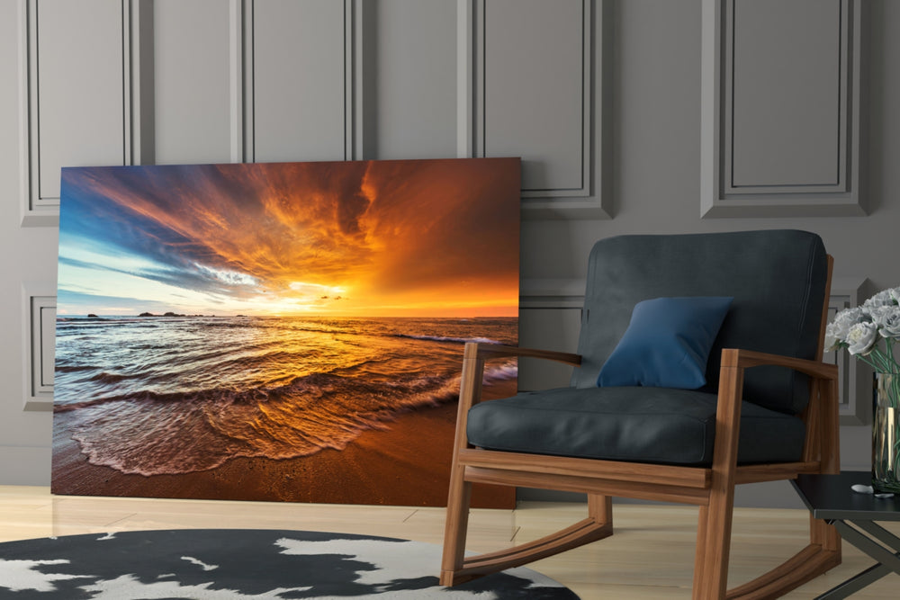 Sunset artwork anchoring a wall with serene coastal palette