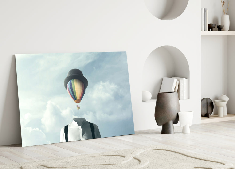 Balloon Heads glass wall art styled above a desk in a study