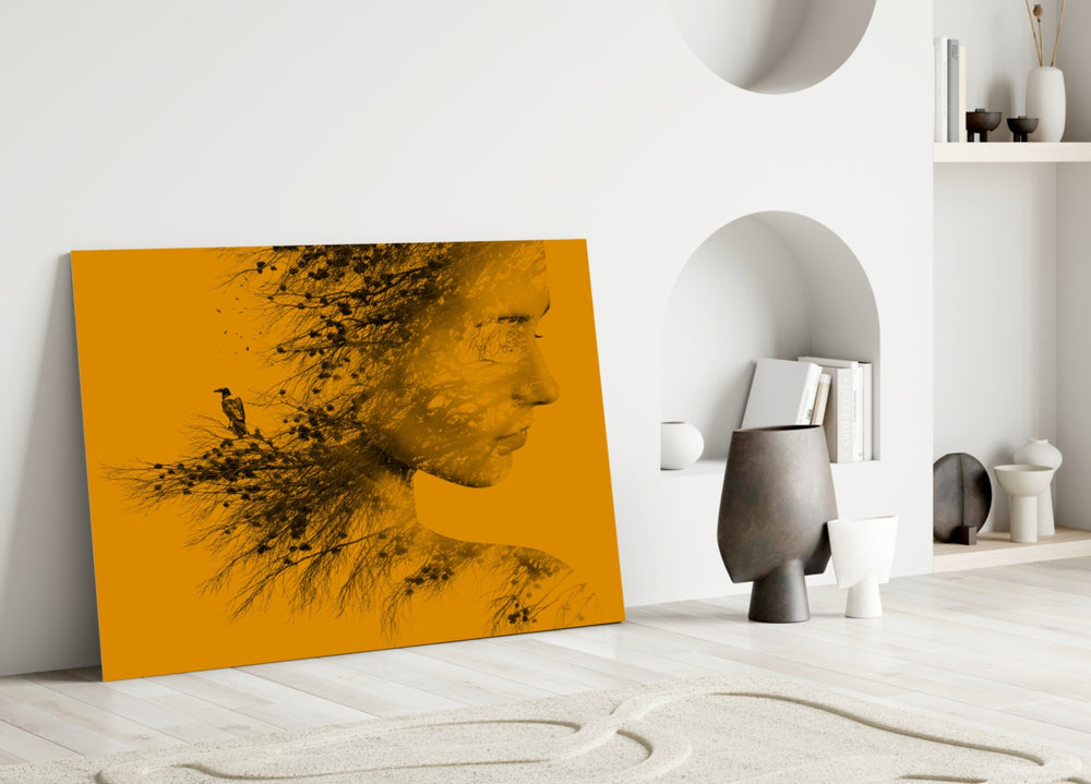 Woman Bird glass wall art styled above a desk in a study