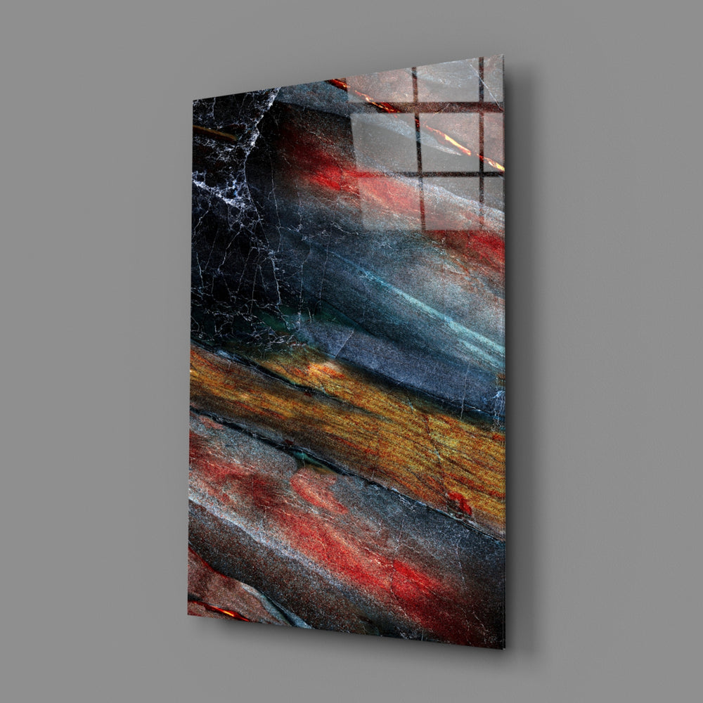 Abstract close-up showing charcoal crimson and amber stone striations