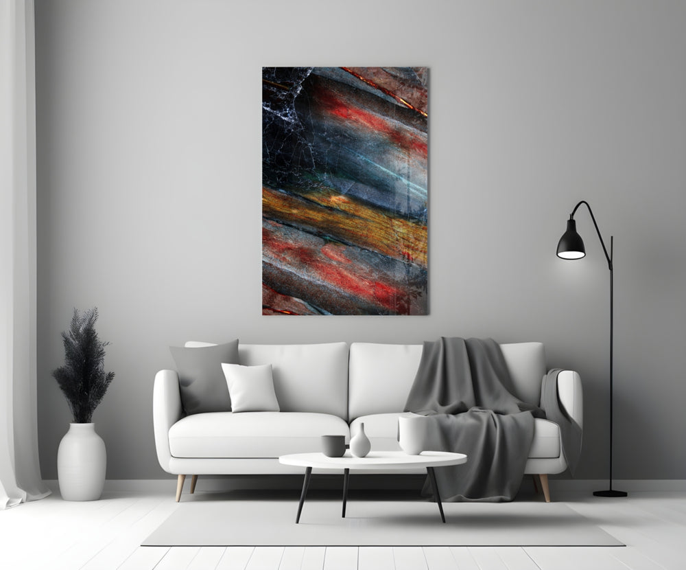 Abstract glass wall art styled above a credenza in a living room