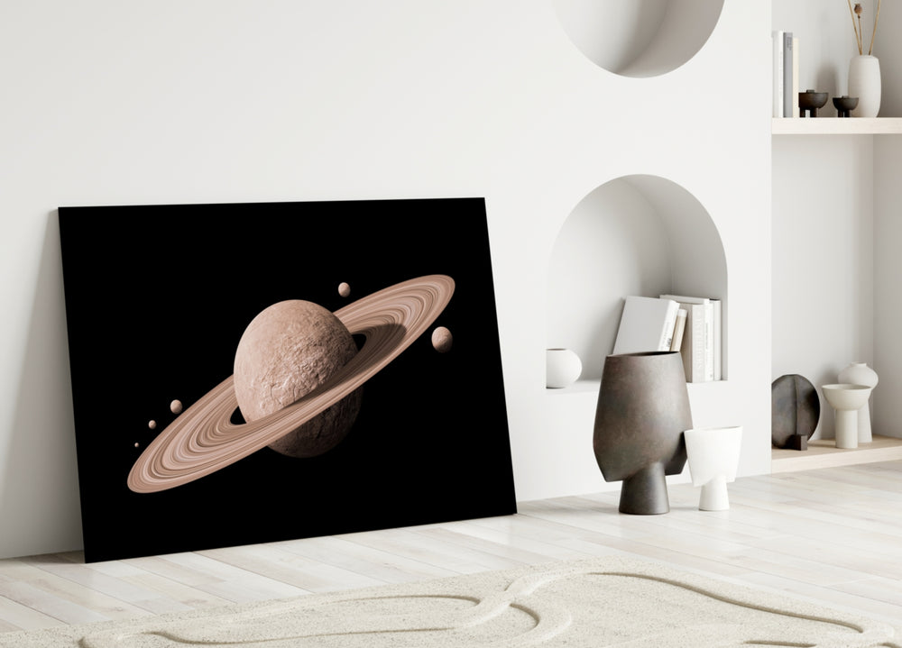 Saturn glass wall art styled above a sofa in a gaming room