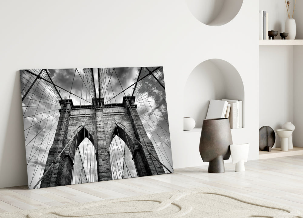 Brooklyn Bridge glass wall art styled above a bench in a living room