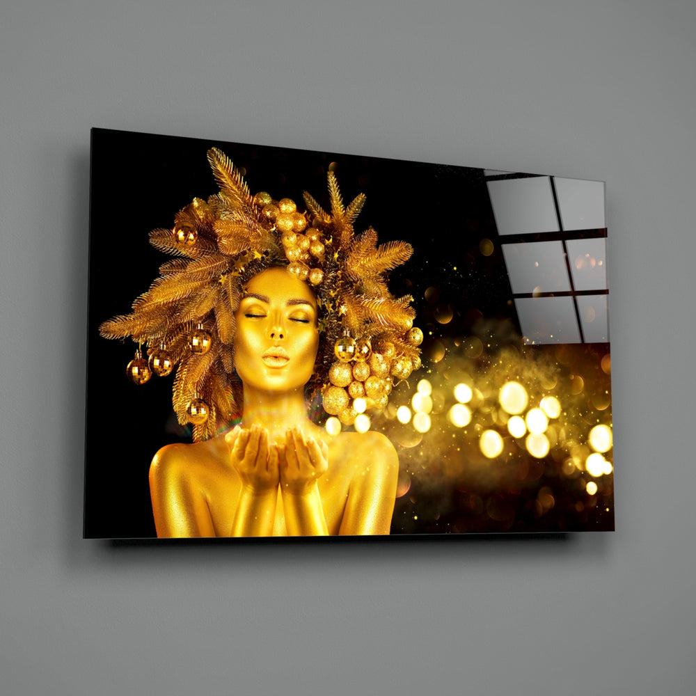 Gold Woman close-up showing gilded muse blowing bokeh with leaf crown