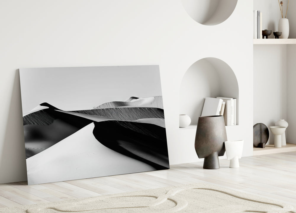 Black Landscape glass wall art styled above a sofa in a living room