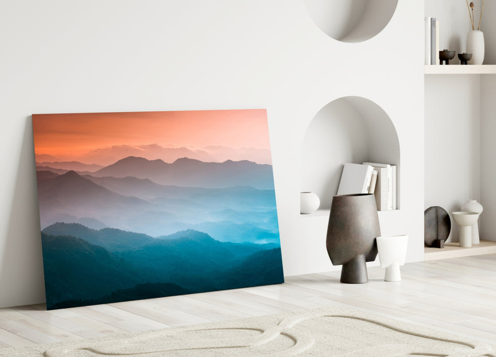 Abstraction glass wall art styled above a credenza in a living room