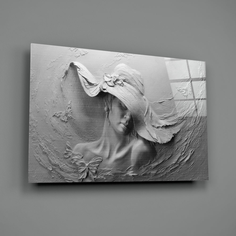 Relief Woman close-up showing sculpted muse in wide-brim hat with butterflies