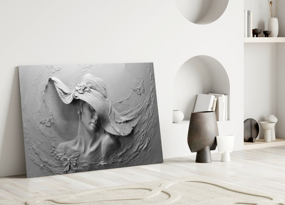 Relief Woman glass wall art styled above a credenza in a living room